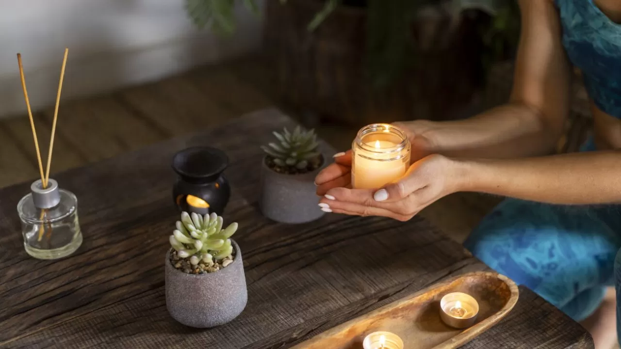 high-angle-woman-holding-candle